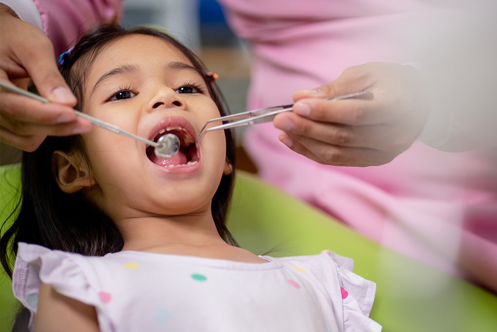 cavity treatment going on on kid.