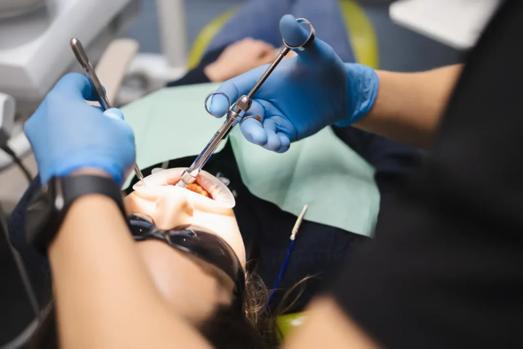 Emergency Dentist in Mackenzie giving dental anesthesia to the patient