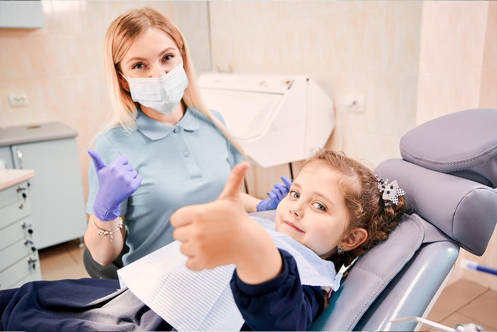 dentist taking ccare of toothache in children