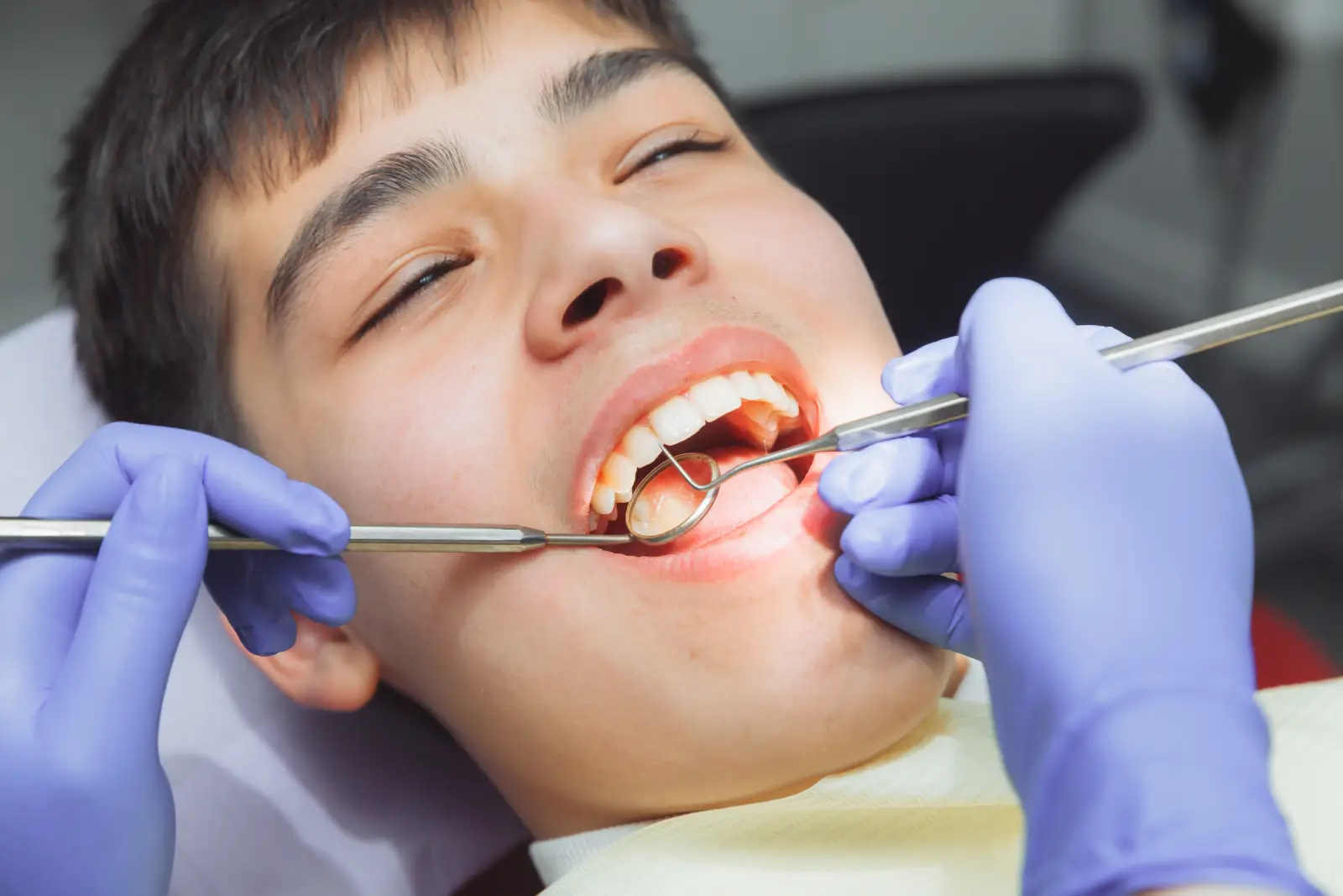 dentist examining patient