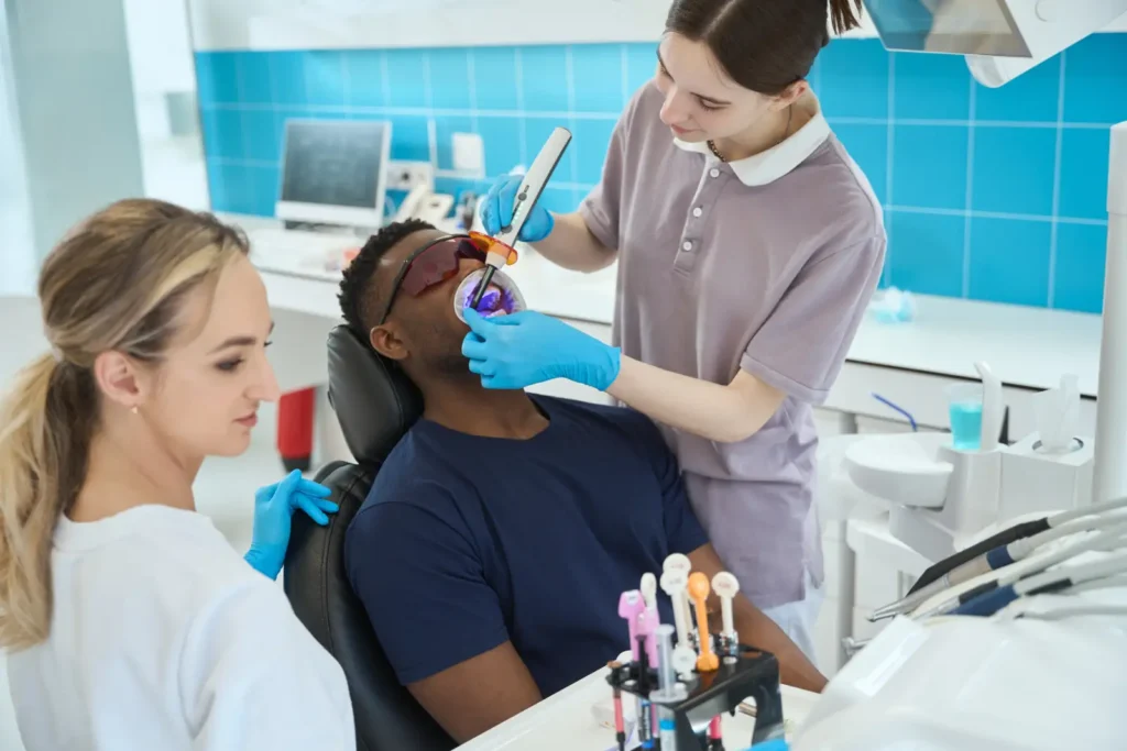 woman doctor treating patient in the sedation dentistry