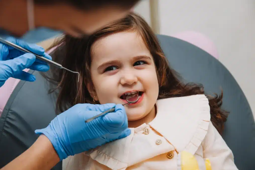 doctor examines the-oral cavity