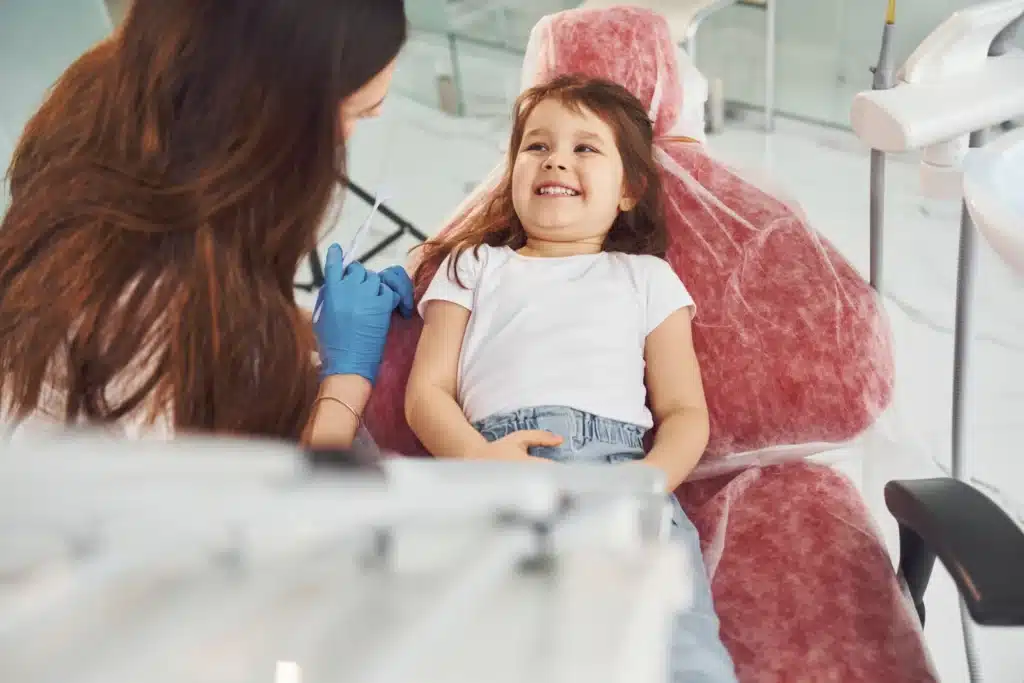 girl visiting dentist in clinic