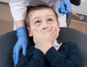 close up of the anxious boy in dental cliniic